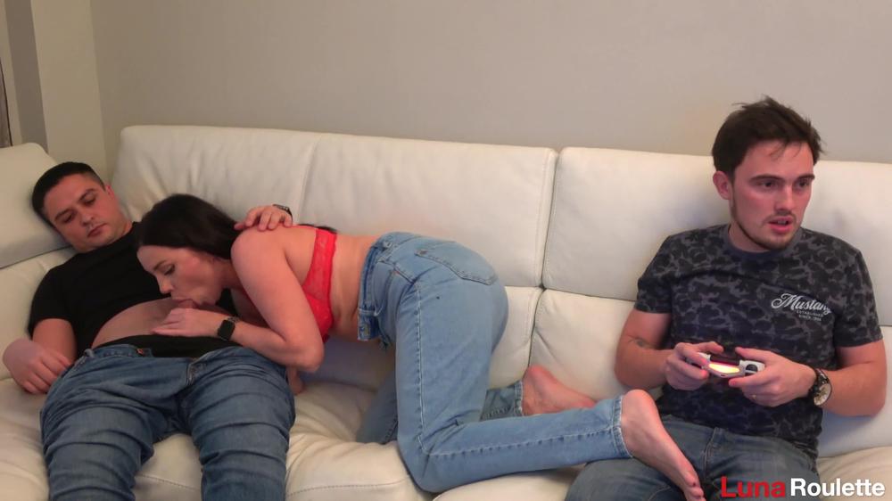 The husband was busy playing while I was giving a blowjob to his friend
