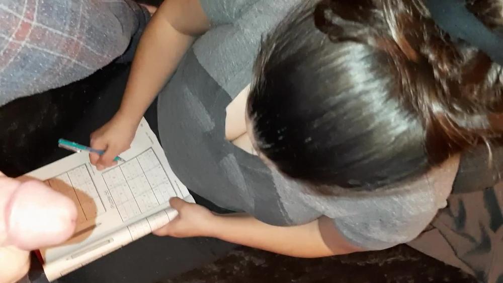 Unexpected cumshot for stepsisters big titty friend while she played Sudoku.