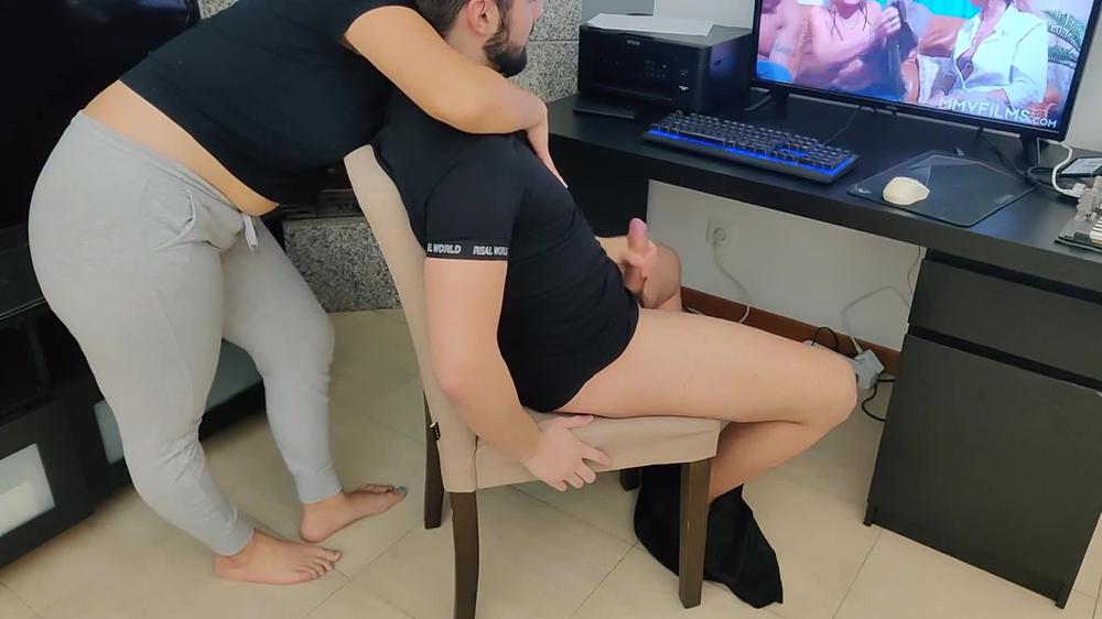 mature mom gives her stepson a handjob while watching porn