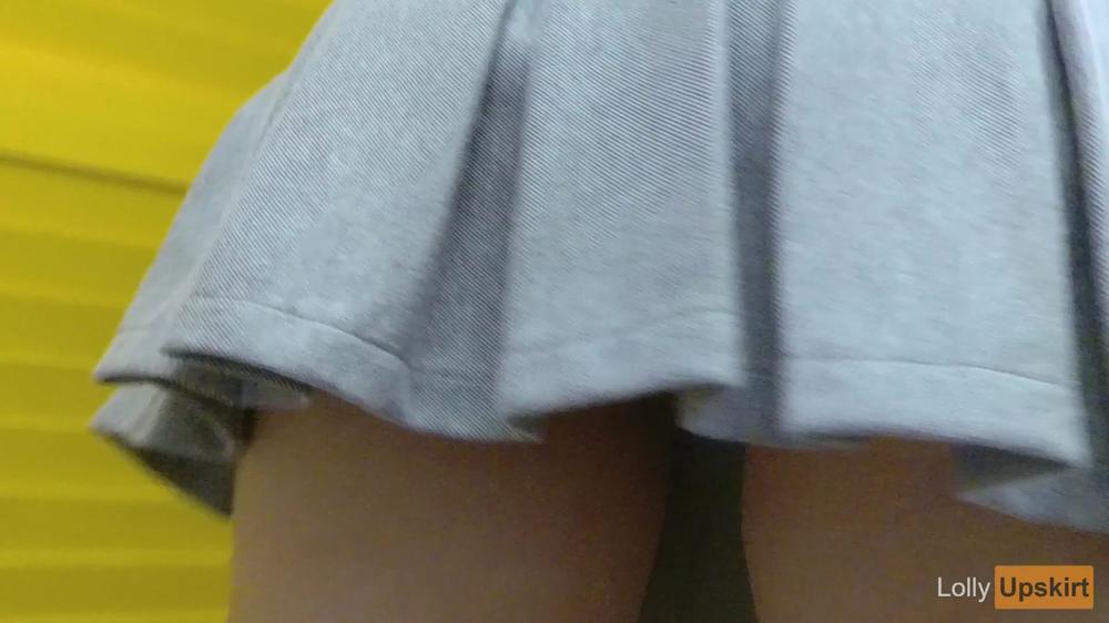 Petite girl shows pussy upskirt without panties in the store