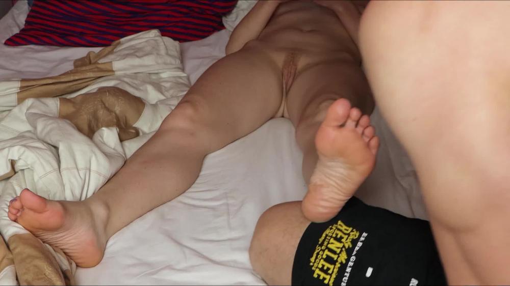 Foot massage for a naked girl with a shaved pussy.