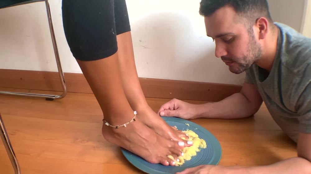 ENOLA FEEDING HER FOOT SLAVE WITH CRUSHED BANANA BY HER FEET
