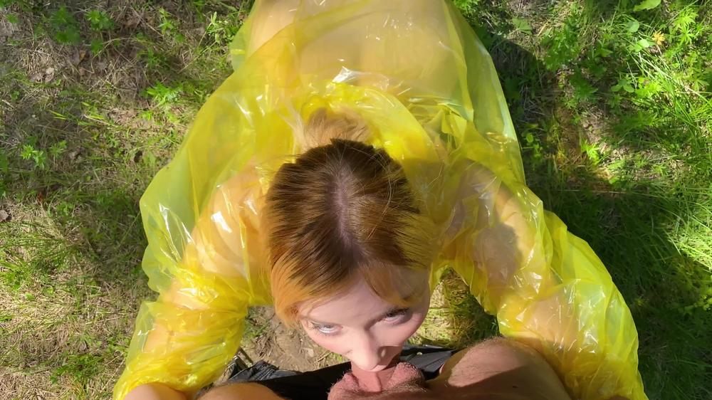 Girl in pvc raincoat suck dick in the forest
