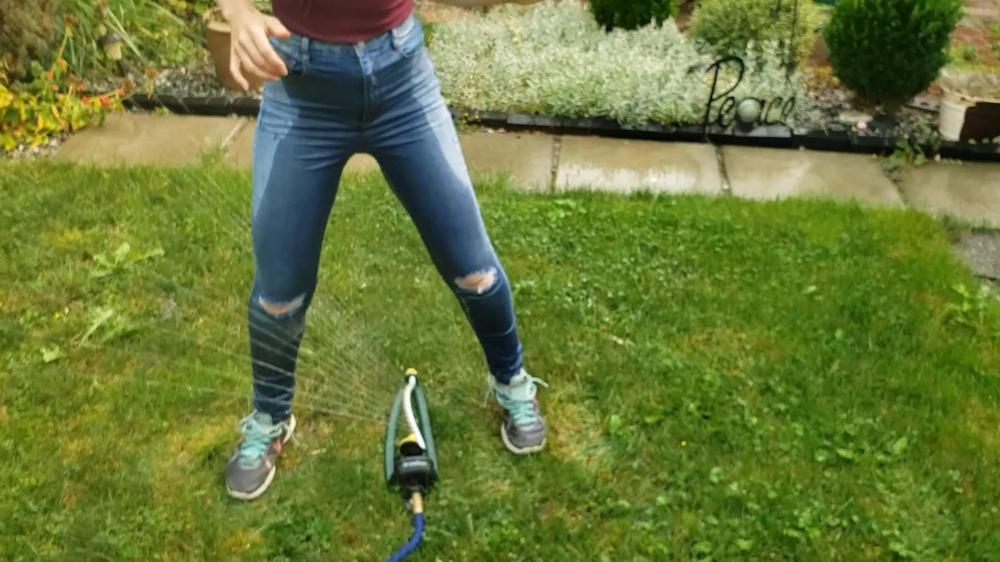 Wetting My Jeans Into sockless Shoes then soaking in the sprinkler