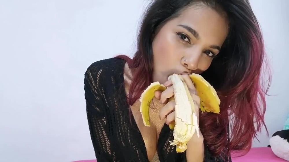 Enjoying a banana. Mila Garcia