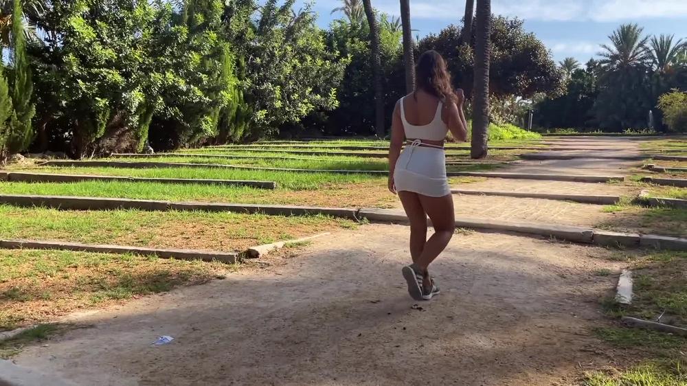 Beautiful girl shows her body and sucks a dick in a city park