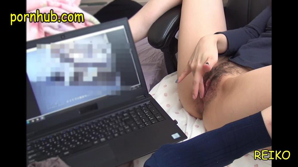 Japanese mature woman masturbating while watching pornography