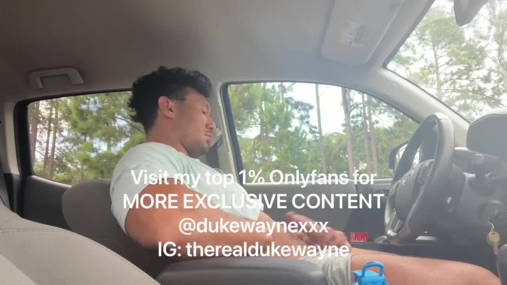 Cumming in a parking lot