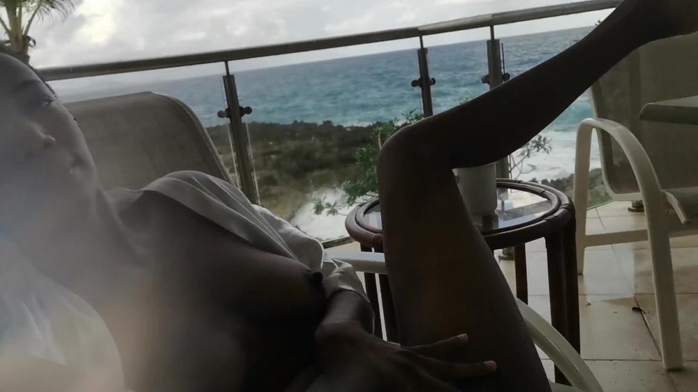 Hot Ebony Girl doing pee in public Hotel Balcony in her vacation From Caribbean