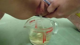 Pee In Measuring Cup - Close Up