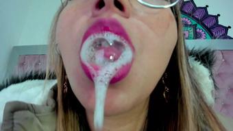 She takes out her dildo and begins to pleasure herself