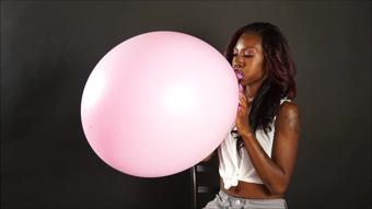 Ivy Bows Large Balloons to Pop