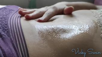 Putting oil on my legs, belly, ass and tits below sunny window - Vicky Swan