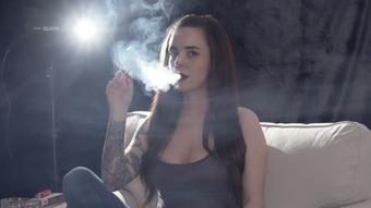 Smoking VS120s in Jeans and Tank Top