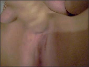 Busty Babe Masturbating Her Shaved Pussy On Bed
