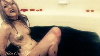 Goth girl plays in the bathtub