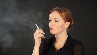 Amy smokes on black background