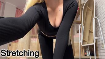Stretching in black leggings - June 09, 2025
