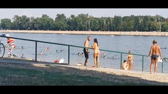 Milf Lilly completely naked on public beach asking for lighter
