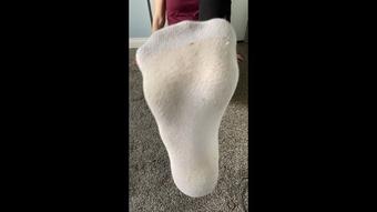 Taking off my dirty, sweaty, white socks
