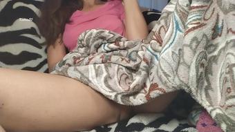 Step sister Masturbates under a blanket while her brother watches a movie