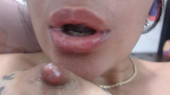 Latina babe fondles her tits and squeezes milk from her hard