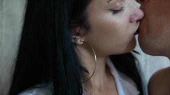 The seductive secretary is very fond of kissing. Hot kisses at work.