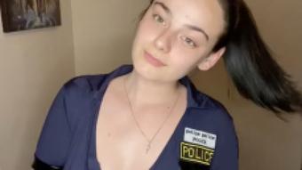 Teen police officer plays with toy