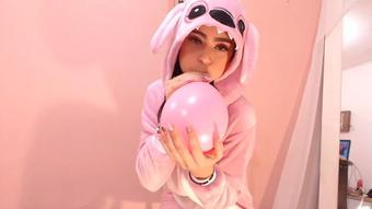 little girl playing with balloons