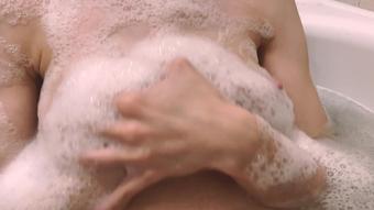 Playing with my tits in foam, bitch relaxing in bath