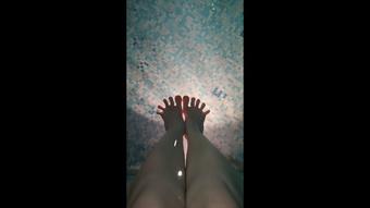 Feet in the pool, wiggling my toes in the water