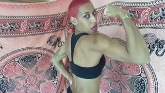 Shaved head girl bicep flexing - June 14, 2021