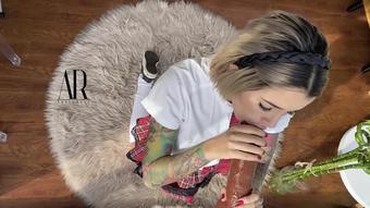 School girl sucking huge black dildo POV