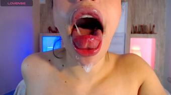 She Licks the Dildo, Making it Shiny and Wet
