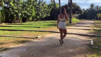 Beautiful girl shows her body and sucks a dick in a city park