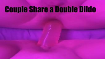 Couple Share a Double Dildo