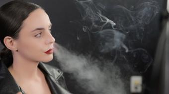 Smoking in Leather Jacket Close-Up