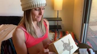 Miss Stacy shows off her woodburning art!