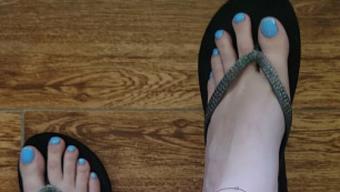 Flip flops under glass desk - August 08, 2022