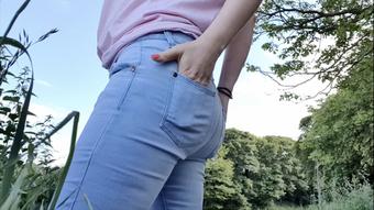 Blue jeans standing outdoor wetting pee - September 07, 2021